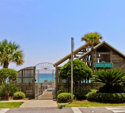Private beach pavilion entrance with showers, rest rooms, rinse showers, wagon parking and  food bar/cabana during peak times