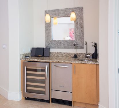 Wet bar equipped with wine fridge, ice maker and mini fridge!