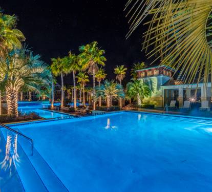The Lagoon pool at night is magical!  Complimentary pool passes included 