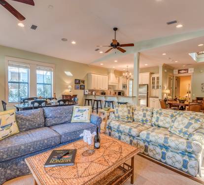 Comfortable couches, flat screen TV, vaulted ceilings with ceiling fans