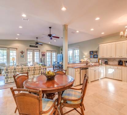 Extra seating off the elegant custom kitchen with granite counter tops &amp; stainless steel appliances