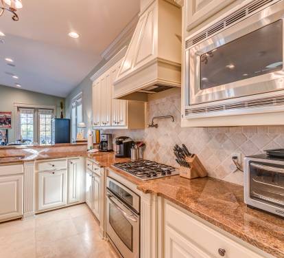 Large open kitchen fully stocked for all your cooking and baking needs!
