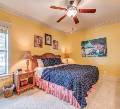 Second Floor King Bedroom with double closet, ceiling fan, TV