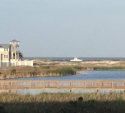 View of the Gulf and the causeway with fishing boats always coming and going!