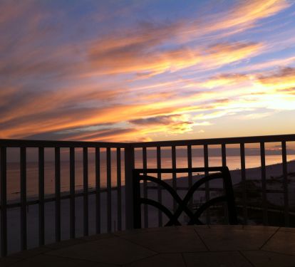 Sit at our table on the balcony and enjoy the dazzling sunsets