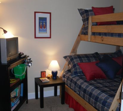 The bunk room has a full/twin bunk bed and a children's library.  