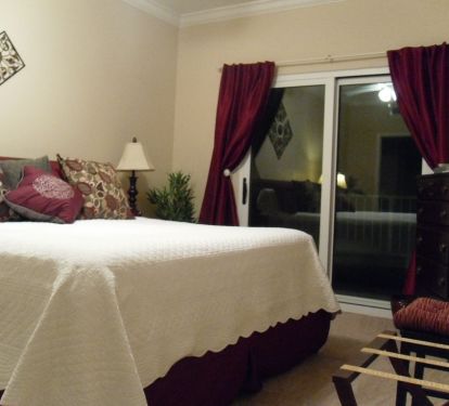 Let the waves help you drift off to sleep, our master bedroom features balcony access 