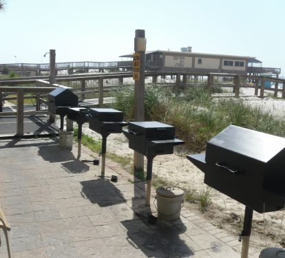 Community charcoal grills are availiable.  Seawind is also adjacent to Sea 'N Suds