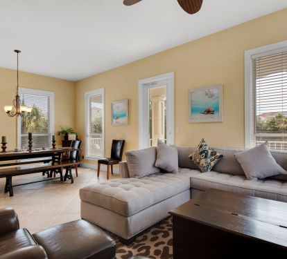 Living room also has 2 large leather chairs and ottomans