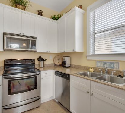 kitchen features granite counter tops and stainless appliances
