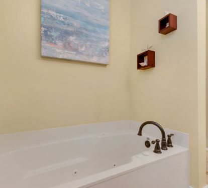 master bath features a jetted tub and separate shower