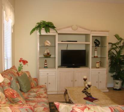 Large flat screen tv and one of the two sofas is a sleeper