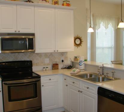 Well equipped kitchen with  granite counter tops and tiled back splash!