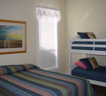 First floor guest bedroom w/ queen bed and twin/twin bunk