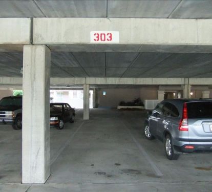Complimentary Covered Parking Space for Occupants of Unit 303.  Near Elevators.
