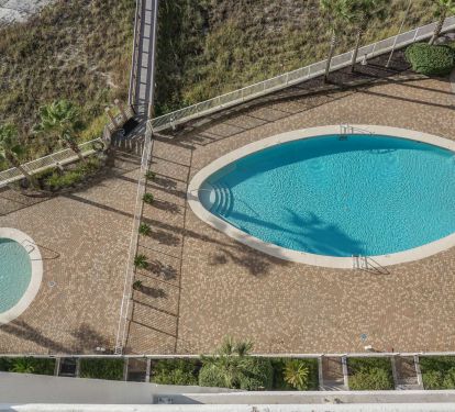 Kiddie pool &amp; beach front swimming pool with covered gazebo &amp; restrooms from balcony.