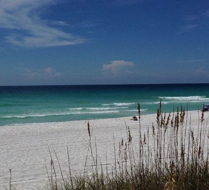 Beautiful white pristine sand and emerald green waters of the Gulf of Mexico