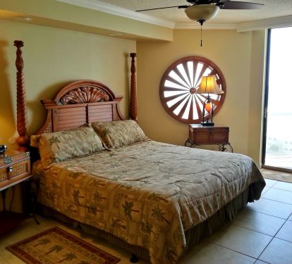 Spacious Master Bedroom King sized bed, Flatscreen TV/DVR clock radio, ceiling fan, large walk-in closet,  Balcony Access