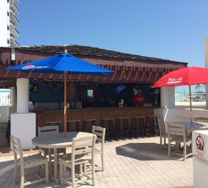 Tiki Hit by the pool serving food and drinks. "Seasonal"