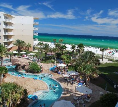 Amazing view of courtyard pools and Gulf from balcony, Lazy River
