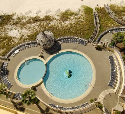 Two level cascading outdoor pools directly in front of the condo