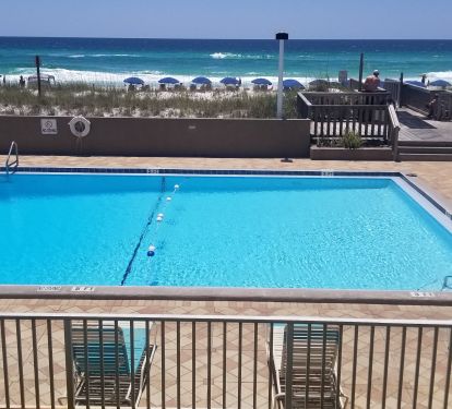 View of the pool from the balcony. Plenty of lounge chairs to tan. 
