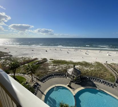 View out to the balcony &amp; beach. Chairs &amp; umbrella service available.