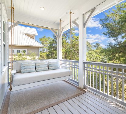 Master bedroom private balcony screened in with bed swing and couch