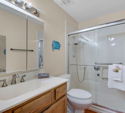 Second bathroom located between both bedrooms has large stand up shower w/seat 