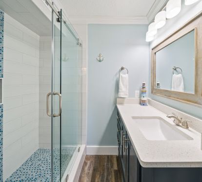 Attached master bath with walk in tile shower.