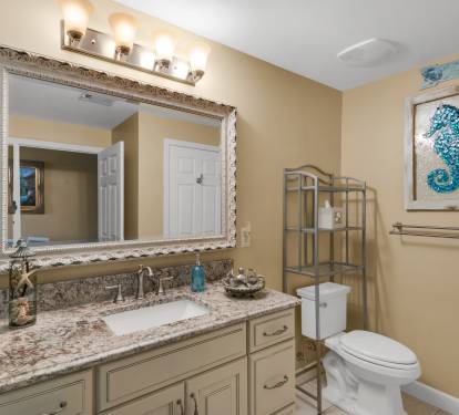 View of Granite Counters and Framed Beveled Mirrors in 2nd Master Bathroom