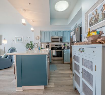 Kitchen with quartz countertops &amp; ample storage capacity