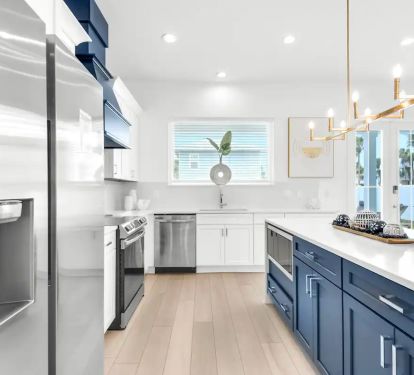 Nautilus-6 Create your culinary masterpieces in Nautilus's new kitchen, featuring stainless appliances with waterfall quartz counters.