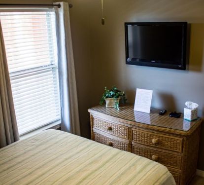 Queen bed, LED flat screen television, Room darkening curtains, and plenty of drawer storage