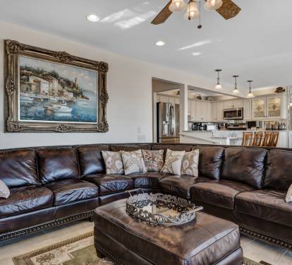 Family Room having Large Sectional and Original Art on Wall