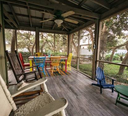 Wonderful back porch with many areas to sit, dine, relax, and watch t.v.