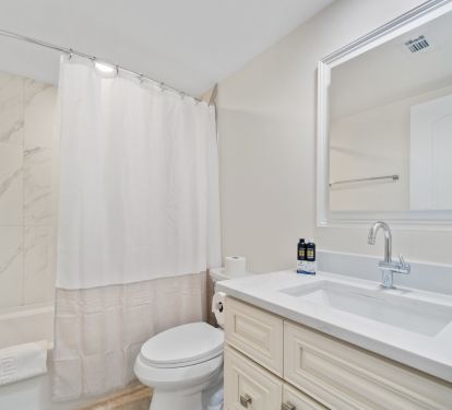 Newly renovated guest bath with tub/shower combo.