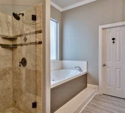 En suite 1st floor bathroom with walk-in shower &amp; Jacuzzi tub and twin vanities