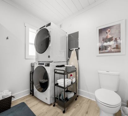 Large bathroom also houses a full-size stacking washer/dryer