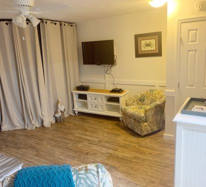 Room darkening drapes for guests who use the sofa bed