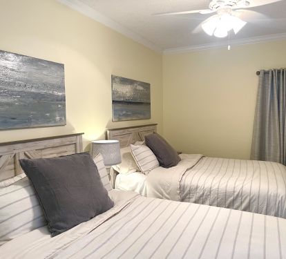 YELLOW GUEST BEDROOM WITH (2) QUEEN BEDS, FLAT SCREEN TV, DRESSER &amp; SIDE TABLES