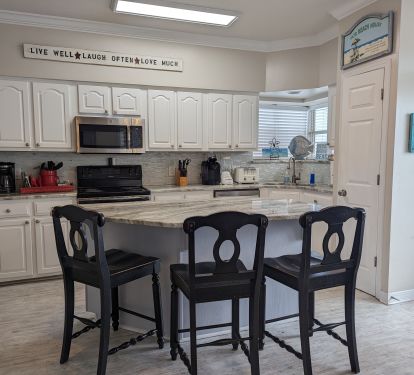 kitchen area with solid surface island and counters.