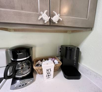 Brew your own coffee in our standard coffee maker. Or you can enjoy our complimentary tea and coffee K-cups in the Kuerig.