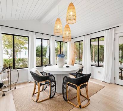 Dining area with Shiplapped ceilings and posh bar cart 