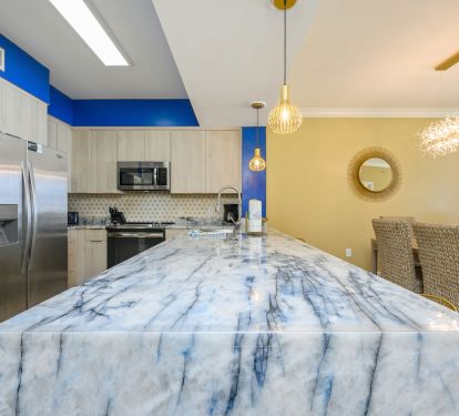 Wow! Who could forget this one-of-a-kind blue and gold veined stone slab?