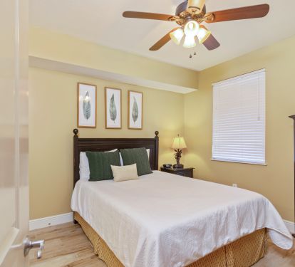 The third bedroom has a queen bed, two closets, TV, and access to a full bath
