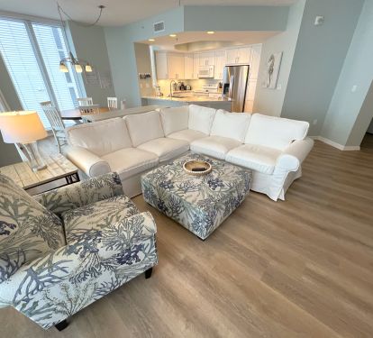 Open and spacious living area in a soothing seaside decor. 
