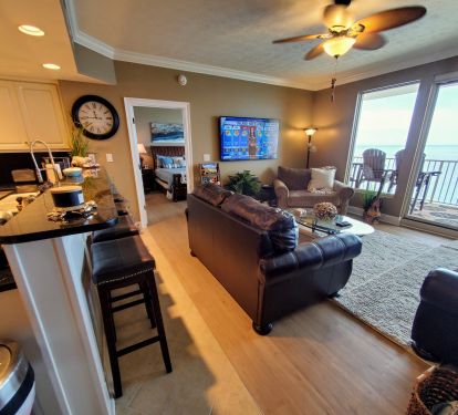 LR has 65 in. Smart TV &amp; great a view of gulf. Bar has 4 stools for add'l seats!