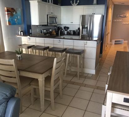 Plenty of places for all to sit down and eat.  Plugs and USB ports on counter.