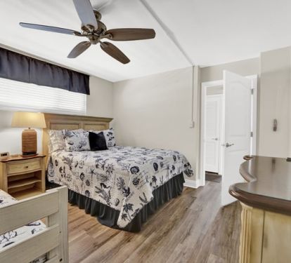 Guest room sleeps 5. Across the hall from kitchen.